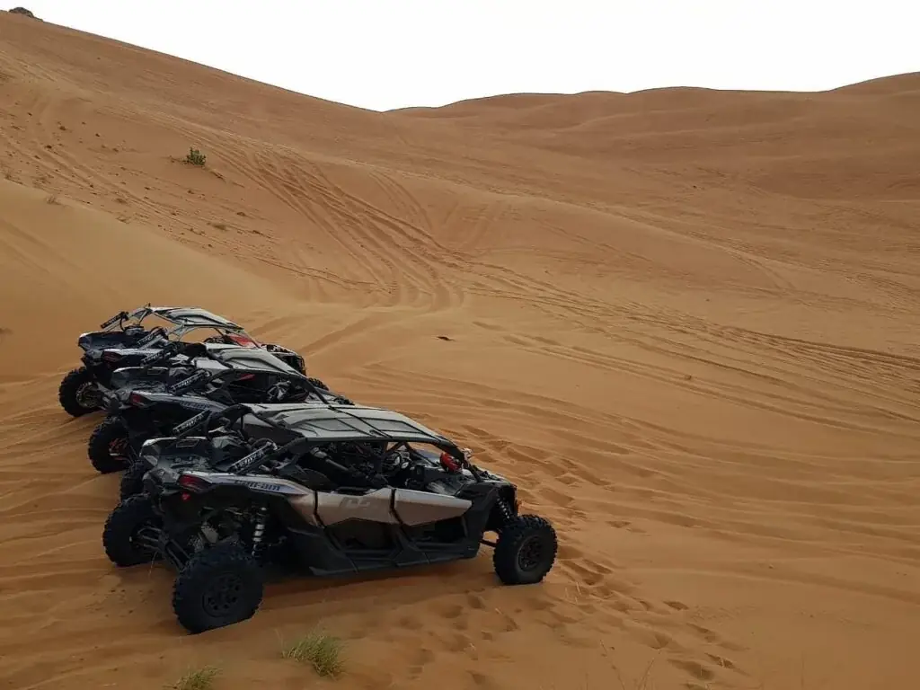 Dune buggies on the Erg Chebbi dunes near Merzouga at sunrise