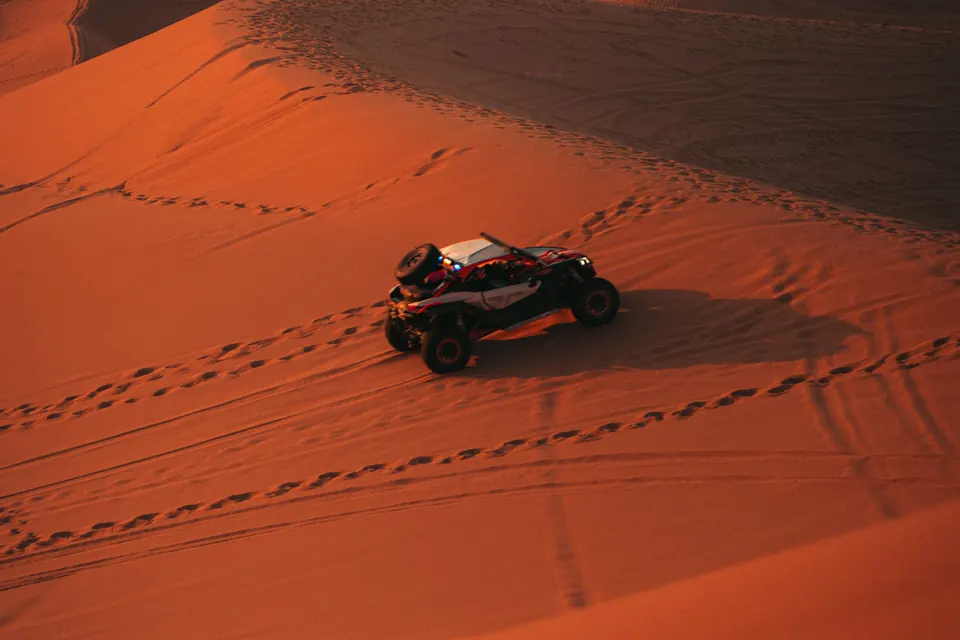 Dune buggy riding across Erg Chebbi at sunset