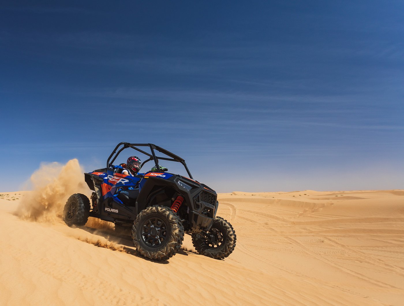 A buggy drifting on the sand in a desert